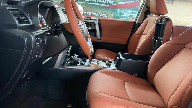 Cognac leather front cabin of a Toyota SUV after a full interior detail