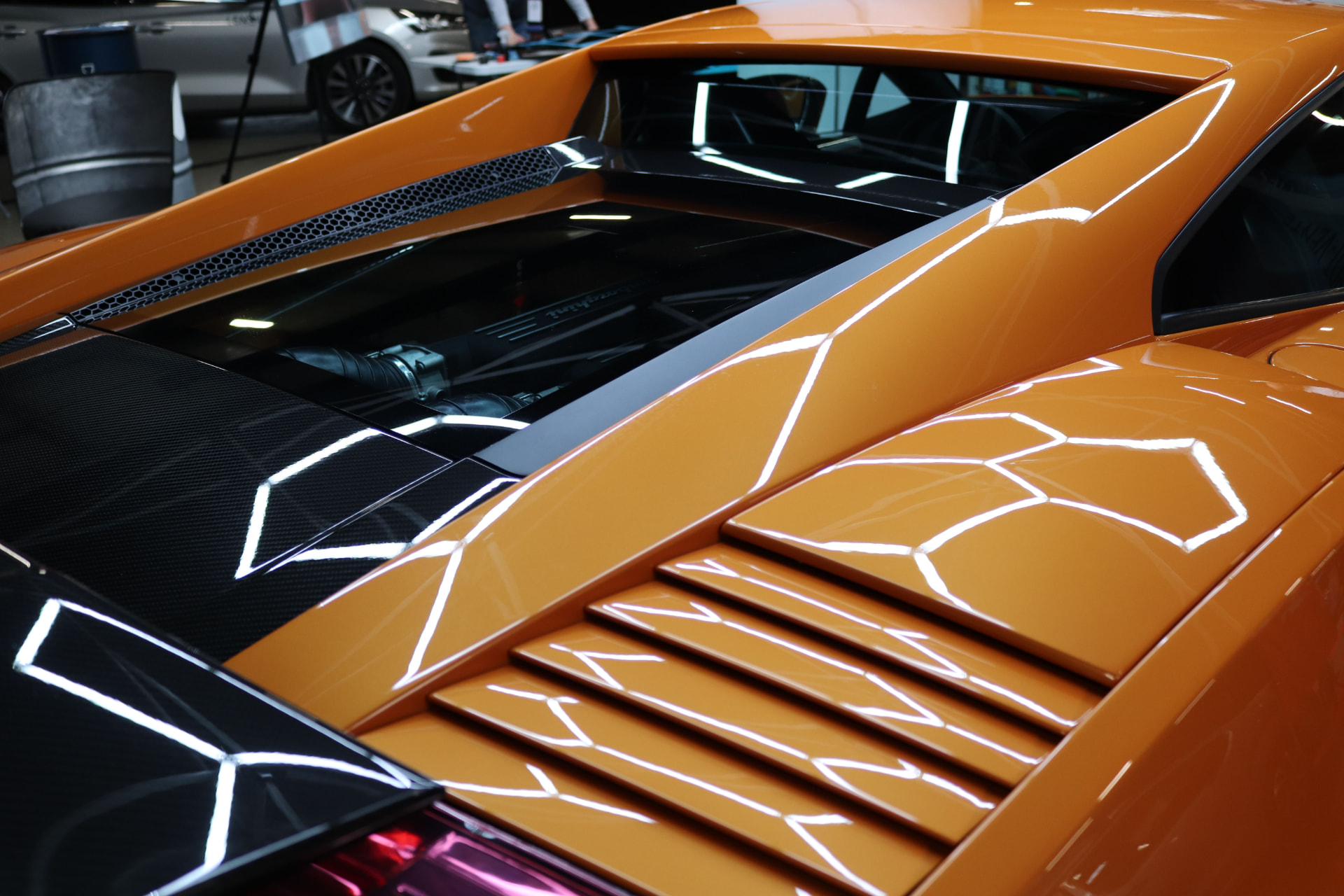 Full detailing service - orange supercar with a glossy restored finish