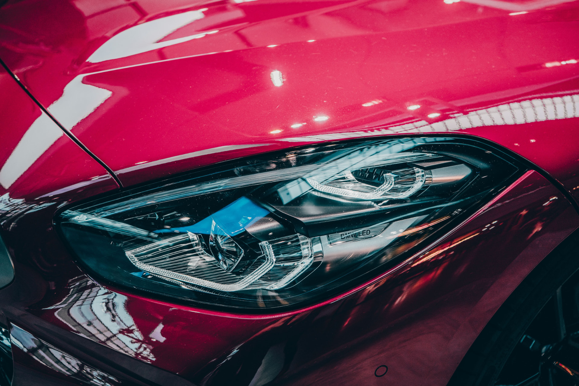 Paint correction service - red car with a mirror-like glossy finish