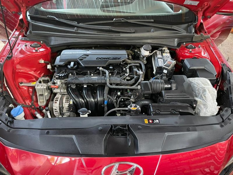 Red Hyundai Smartstream DOHC 16V engine bay after cleaning and dressing