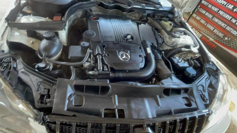 White Mercedes-Benz engine bay detailed, engine cover and plastics dressed
